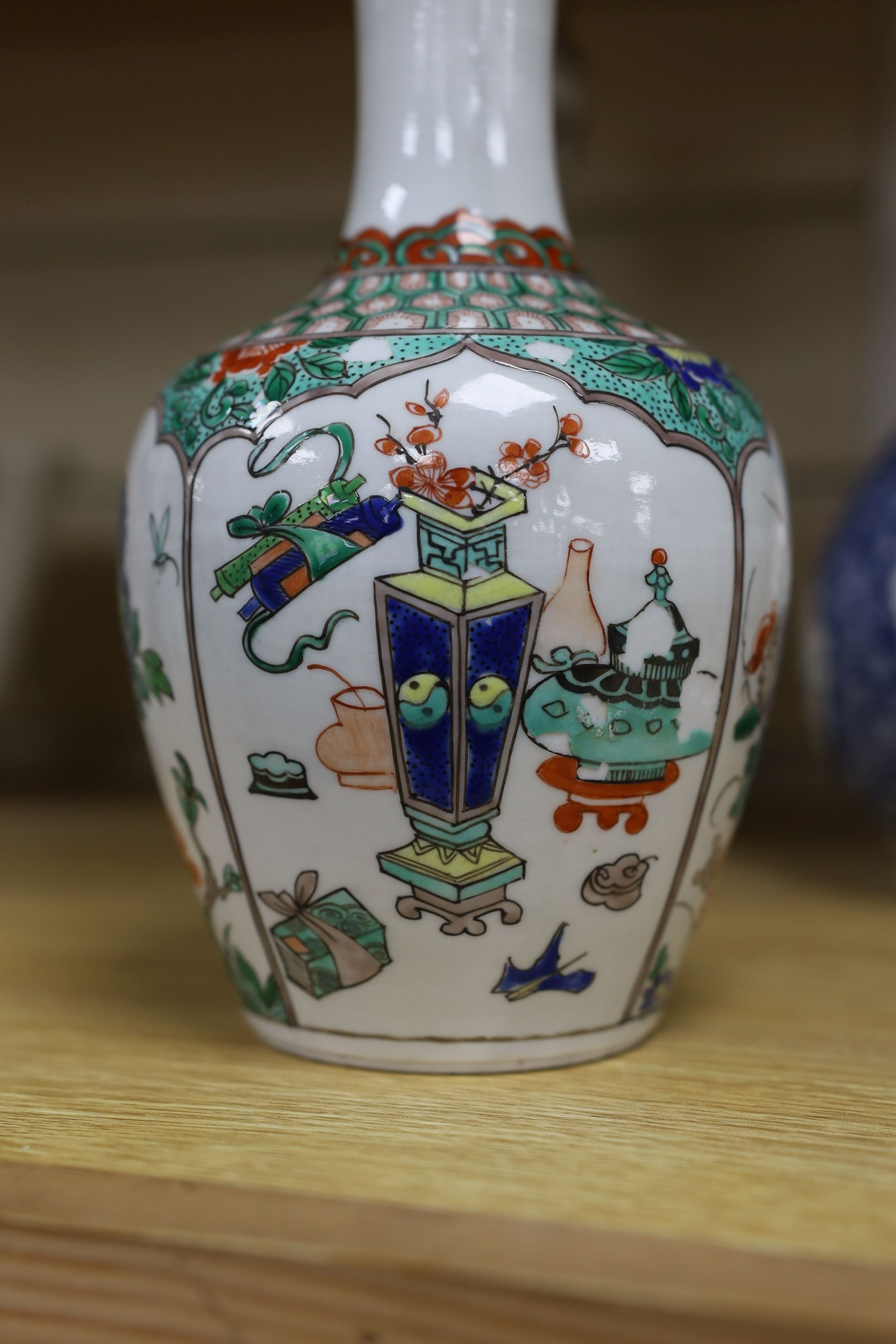 A pair Samson of Paris vases in the Chinese famille verte style and a Chinese Qianlong famille rose garlic neck vase with blue panelling motif, tallest 26cm